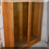 F36. Oak glass front bookcase. 52”h x 40”w x 14”d 